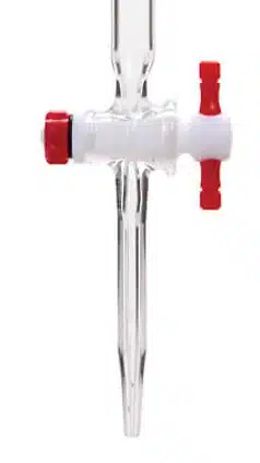 Glass burette stopcock with a red and white plastic handle, used to control the flow of liquid in laboratory titrations, often alongside reference materials like the periodic table.